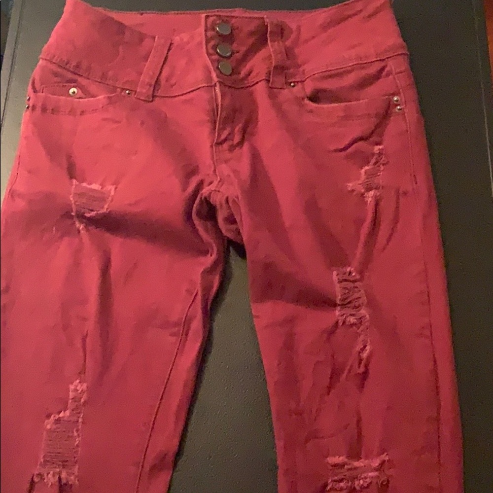 Destressed maroon jeans